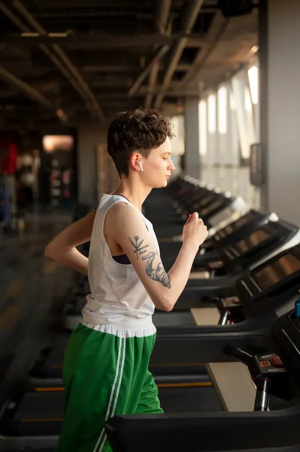 Runner training on a treadmill with the incline properly set to simulate air resistance