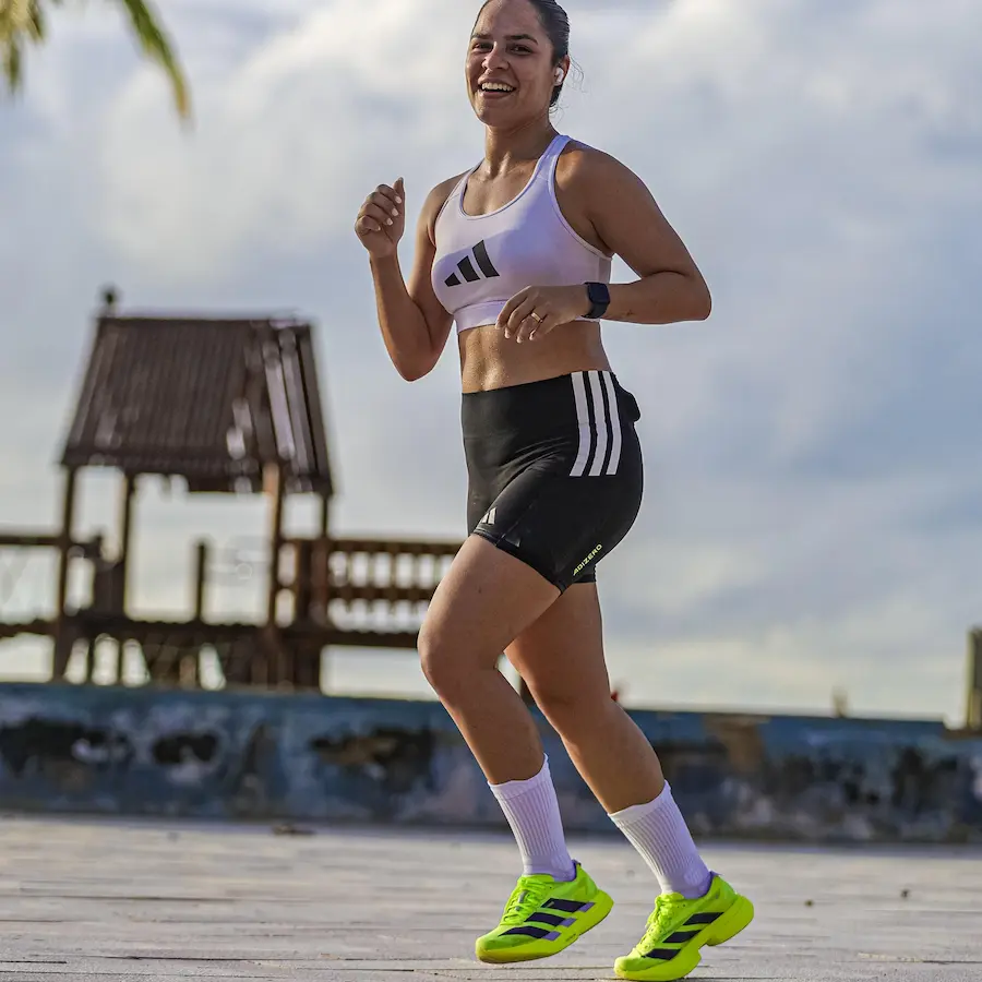 Runner wearing adidas carbon-plated shoes during a half marathon